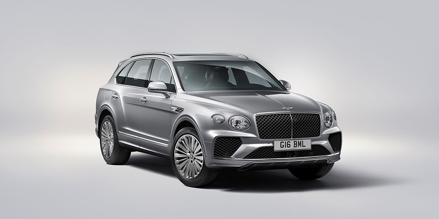 Bentley Stockholm Bentley Bentayga luxury SUV front three quarter view in Moonbeam paint with matrix grille and 21″ 5 spoke painted wheels