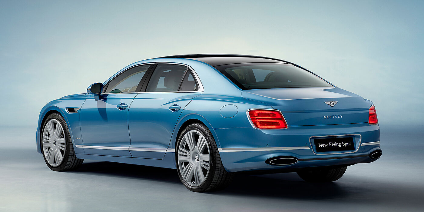 Bentley Stockholm New Bentley Flying Spur Azure sedan rear view in Light windsor blue by Mulliner paint with 22 inch Azure wheels and chrome exterior details
