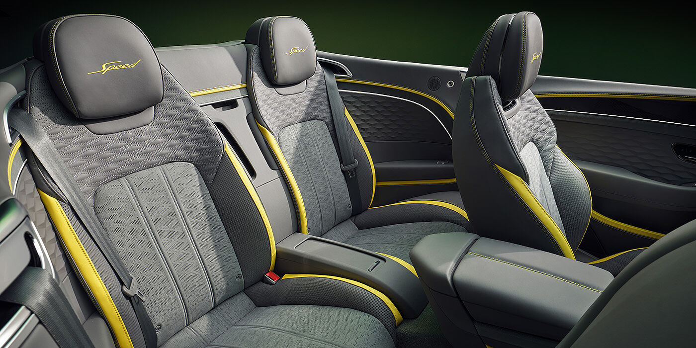 Bentley Stockholm Bentley New Continental GTC Speed convertible rear interior with unique Speed colour split in Gravity Grey and Cyber Yellow hide colours, and contrast stitched headrest emblems 