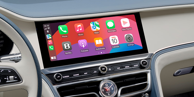 Bentley Stockholm New Bentley Flying Spur Azure sedan front cabin central MMI screen showing available services against Linen and Brunel hides and Piano Linen veneer